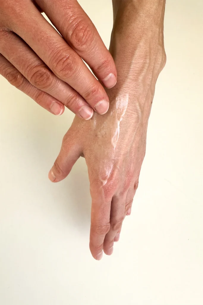Applying ceramide barrier-repair cream to hand — once-daily protocol during menopausal skin barrier-repair experiment